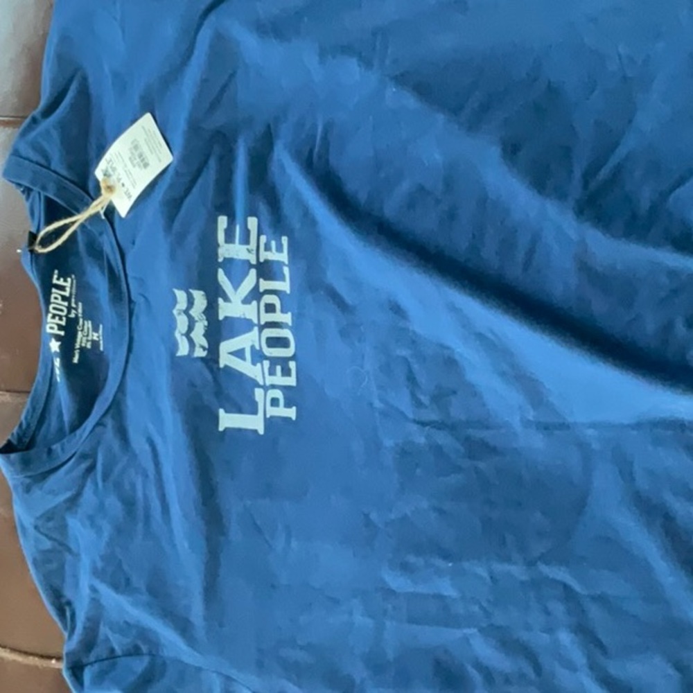 2 size medium new with tags T-shirts. One old guys rule and one we people..